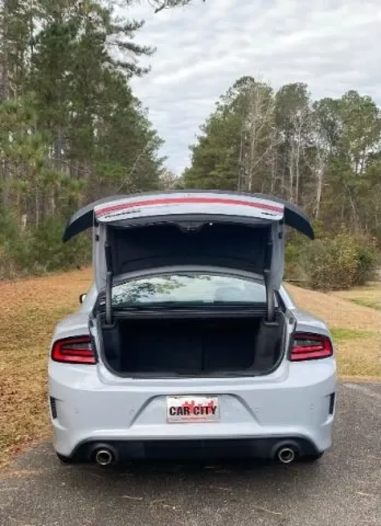 2022 /Black Dodge Charger GT (2C3CDXHG9NH) with an 3.6L V6 DOHC 24V engine, 8-Speed Automatic transmission, located at 9146 Ocean Hwy West, Calabash, NC, 28467, (910) 579-1110, 33.928635, -78.576157 - Experience the thrill of the open road with this stunning 2022 Dodge Charger GT, available now at Car City - Whitesville, your trusted pre-owned dealership located at 3598 James B White Hwy South, Whiteville, NC 28472. Whether you're commuting to work or embarking on weekend adventures, this vehicle - Photo#5