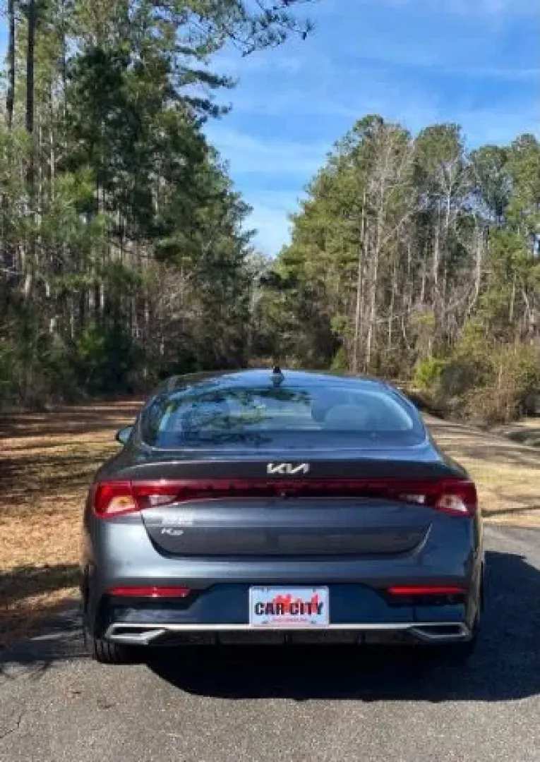 2022 /Black Kia K5 LXS (5XXG14J20NG) with an 1.6L L4 DOHC 16V engine, 8-Speed Automatic transmission, located at 9146 Ocean Hwy West, Calabash, NC, 28467, (910) 579-1110, 33.928635, -78.576157 - **Discover Adventure and Comfort with the 2022 Kia K5 LXS: Your Next Family Sedan Awaits!**<br /> <br /> Are you in the market for a vehicle that seamlessly blends style, comfort, and practicality? Look no further than the stunning 2022 Kia K5 LXS available at Car City - Calabash. This sleek sedan i - Photo#3