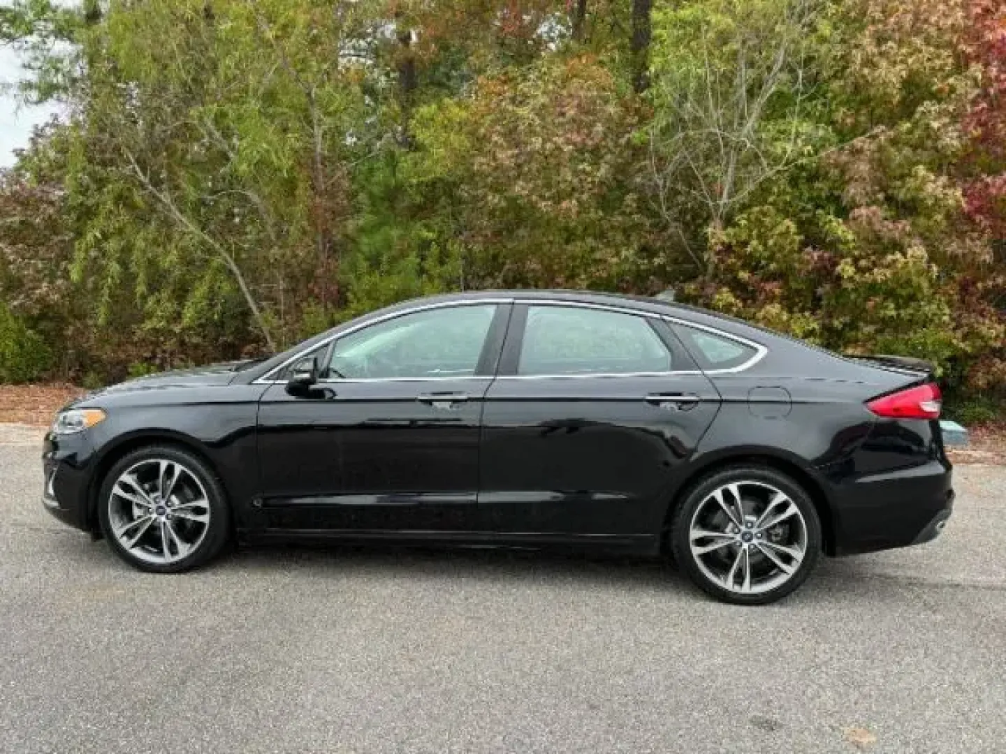 2020 /Ebony, leather Ford Fusion Titanium AWD (3FA6P0D99LR) with an 2.0L L4 DOHC 16V engine, 6-Speed Automatic transmission, located at 9146 Ocean Hwy West, Calabash, NC, 28467, (910) 579-1110, 33.928635, -78.576157 - 2020 Ford Fusion Titanium AWD - Photo#1