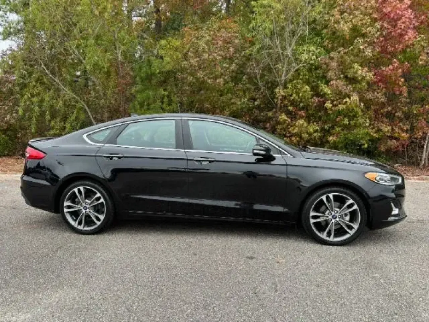 2020 /Ebony, leather Ford Fusion Titanium AWD (3FA6P0D99LR) with an 2.0L L4 DOHC 16V engine, 6-Speed Automatic transmission, located at 9146 Ocean Hwy West, Calabash, NC, 28467, (910) 579-1110, 33.928635, -78.576157 - 2020 Ford Fusion Titanium AWD - Photo#2