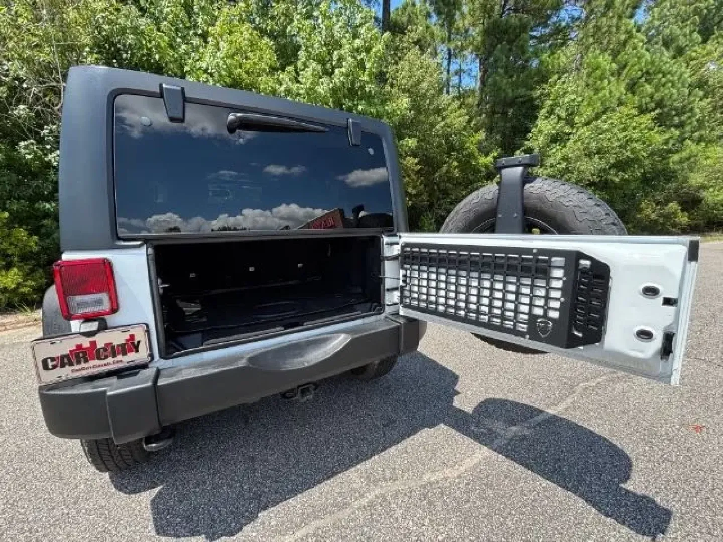 2016 /Black Jeep Wrangler Sport (1C4BJWDG9GL) with an Pentastar 3.6L V-6 DOHC engine, located at 9146 Ocean Hwy West, Calabash, NC, 28467, (910) 579-1110, 33.928635, -78.576157 - **Adventure Awaits with the 2016 Jeep Wrangler Sport - Your Perfect Companion for Life's Journeys!**<br /> <br /> Are you ready for thrilling weekend adventures or daily excursions in a vehicle that combines rugged capability with modern comfort? Look no further than this 2016 Jeep Wrangler Sport, a - Photo#13