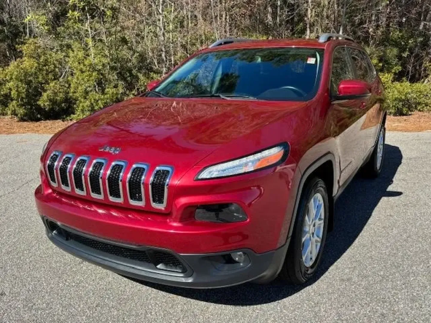 2017 /Black, premium cloth Jeep Cherokee Latitude FWD (1C4PJLCS3HW) with an 3.2L V6 DOHC 24V engine, 9-Speed Automatic transmission, located at 9146 Ocean Hwy West, Calabash, NC, 28467, (910) 579-1110, 33.928635, -78.576157 - Weekend beach runs to Sunset Beach, a smooth daily commute up Ocean Hwy (US-17), or a spontaneous road trip down to Myrtle Beach-this 2017 Jeep Cherokee Latitude FWD is built for the coastal Carolina lifestyle. With its Deep Cherry Red Crystal Pearl Coat exterior and comfortable black premium cloth - Photo#0