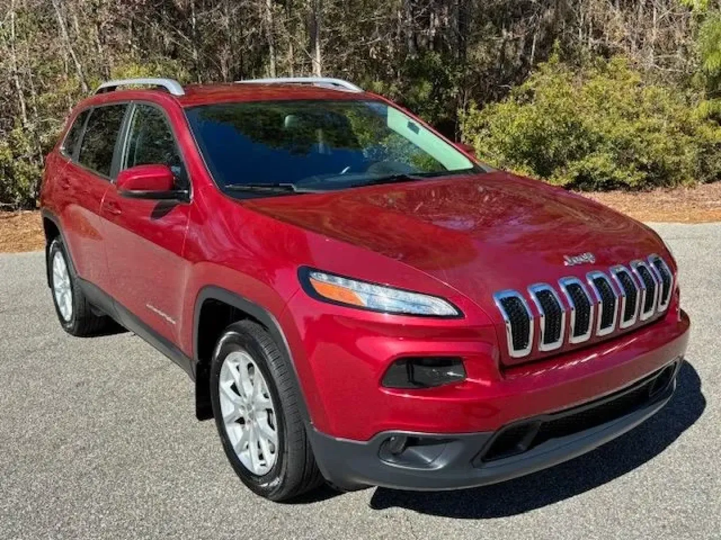 2017 /Black, premium cloth Jeep Cherokee Latitude FWD (1C4PJLCS3HW) with an 3.2L V6 DOHC 24V engine, 9-Speed Automatic transmission, located at 9146 Ocean Hwy West, Calabash, NC, 28467, (910) 579-1110, 33.928635, -78.576157 - Weekend beach runs to Sunset Beach, a smooth daily commute up Ocean Hwy (US-17), or a spontaneous road trip down to Myrtle Beach-this 2017 Jeep Cherokee Latitude FWD is built for the coastal Carolina lifestyle. With its Deep Cherry Red Crystal Pearl Coat exterior and comfortable black premium cloth - Photo#1