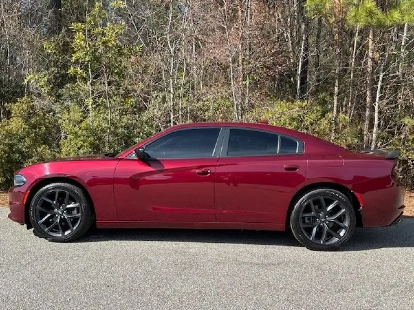 2023 /Black Dodge Charger SXT (2C3CDXBG1PH) with an Pentastar 3.6L V-6 DOHC engine, 8A transmission, located at 2761 East Hwy 501, Conway, SC, 29526, (843) 331-1151, 33.781528, -78.989883 - Weekend escape to Myrtle Beach, a confident daily commute down Highway 501, or a sleek ride for date night in Downtown Conway-this 2023 Dodge Charger SXT is built for drivers who want muscle-car attitude with real-world comfort. Finished in head-turning Octane Red Pearlcoat with a refined Black inte - Photo#2