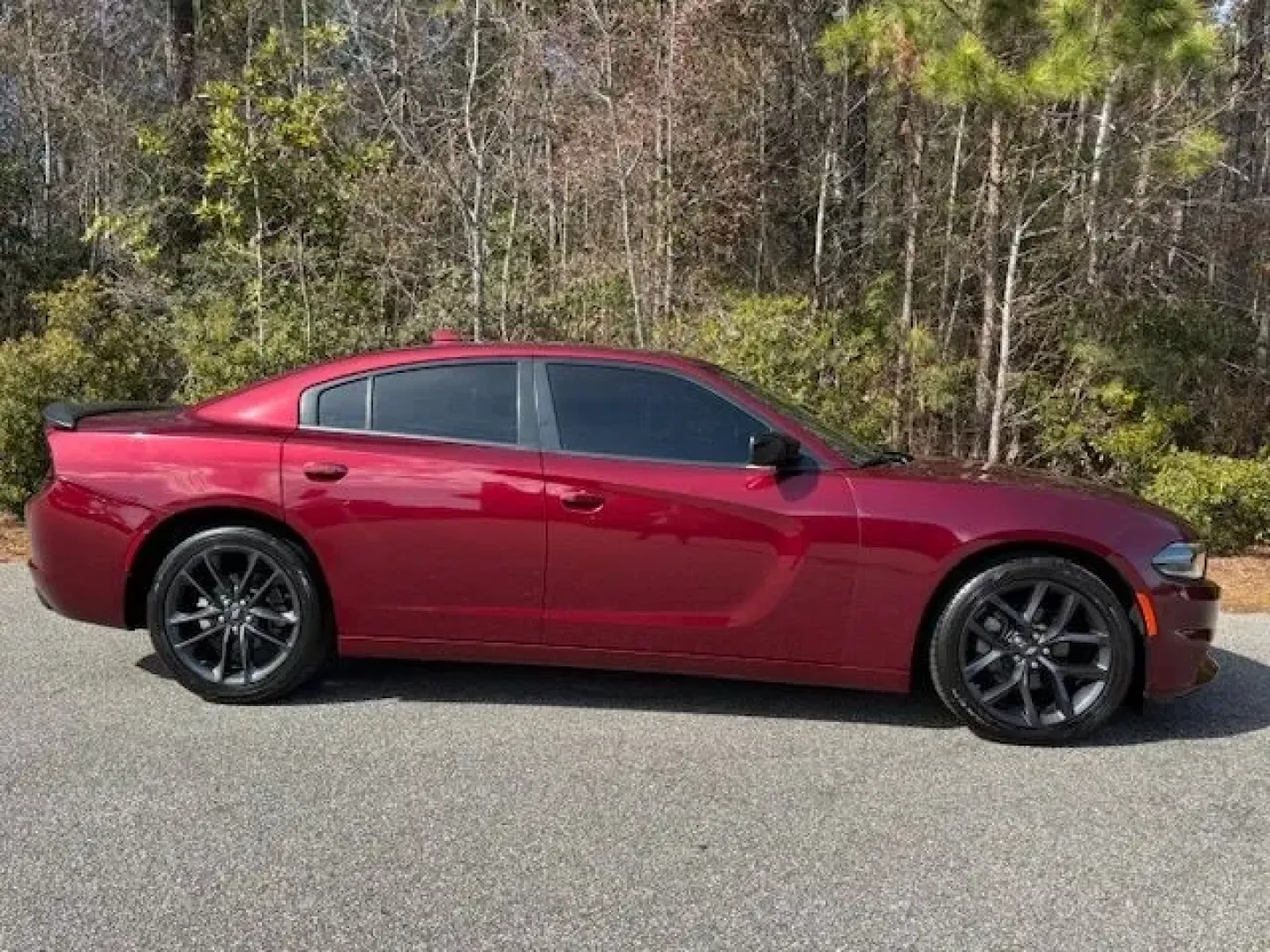 2023 /Black Dodge Charger SXT (2C3CDXBG1PH) with an Pentastar 3.6L V-6 DOHC engine, 8A transmission, located at 2761 East Hwy 501, Conway, SC, 29526, (843) 331-1151, 33.781528, -78.989883 - Weekend escape to Myrtle Beach, a confident daily commute down Highway 501, or a sleek ride for date night in Downtown Conway-this 2023 Dodge Charger SXT is built for drivers who want muscle-car attitude with real-world comfort. Finished in head-turning Octane Red Pearlcoat with a refined Black inte - Photo#3